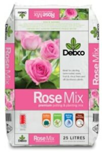 A 25L bag of Debco Rose Soil Mix 25L, designed for planting roses and other flowering plants. The packaging features pink roses and various product information icons.