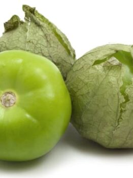 Three tomatillos, with two partially in husks, are set against a white background.