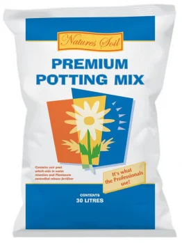 A white bag labeled "Nature's Soil Premium Potting Mix 30L" displays stylized flowers and clear text showing it contains potting mix.