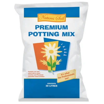 A white bag labeled "Nature's Soil Premium Potting Mix 30L" displays stylized flowers and clear text showing it contains potting mix.