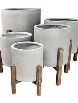 five different sized feature pots for plants in cement grey colour with wooden brown leg stands