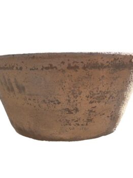 A large terracotta bowl on a white background.