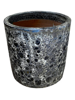 The speckled, cylindrical Seafoam Bermuda Planter Aqua S 30x20cm features a rough texture and dark interior, ideal for bringing a natural touch to any space.
