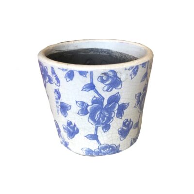 White ceramic pot with blue floral patterns on the surface.