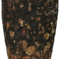 A tall, textured brown and black ceramic vase with a rustic, mottled appearance reminiscent of the Seafoam Cylinder Planter Dark Grey M 30x30cm.