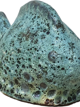 The Portica Dog Grey Decor L 19x14x23cm features a textured rock design with a weathered green-blue surface and small holes, echoing the rugged charm of nature.
