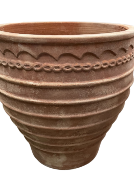 Large terracotta flower pot with decorative horizontal ridges and a scalloped pattern near the rim, set against a white background.