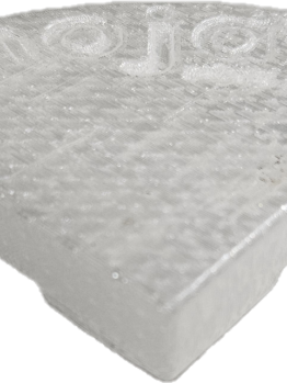 A translucent, wedge-shaped plastic object with a textured surface, "mojay" embossed on top, and a subtle hint of Glazed Cylinder White XL 50x50cm in its finish.