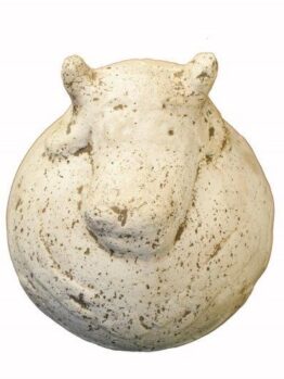 A round, speckled, white sculpture resembling the head of a hippopotamus, viewed from above against a plain background.