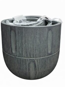 A medium, empty GardenLite Torino Tapered Planter Rust with textured sides and packaging materials inside, shown against a plain white background.