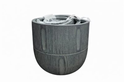 A medium, empty GardenLite Torino Tapered Planter Rust with textured sides and packaging materials inside, shown against a plain white background.