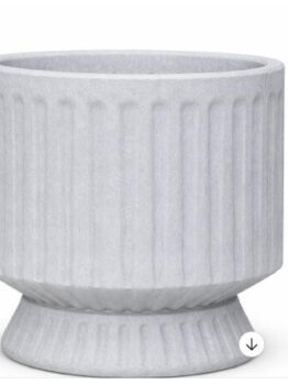 A white, round planter with vertical ridges and a flared base, displayed against a plain background.