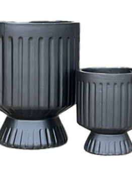 A Balmoral Raised Cylinder Black planter (27x33cm) with a ribbed design and pedestal base is displayed on a plain white background.