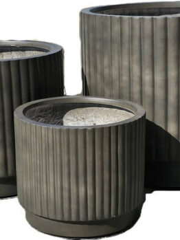 A set of three empty, ribbed Balmoral Corrugated Cylinder Black planters in varying sizes is displayed together against a white background.