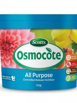 A 700g container of Osmocote Controlled Release Fertiliser: Total All Purpose, featuring flowers and vegetables on the label and key product highlights.