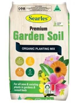 A 30L bag of Searles Premium Garden Soil organic planting mix, featuring images of flowers and product benefits on the packaging.